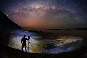 Photographer taking a photo of the Milky Way