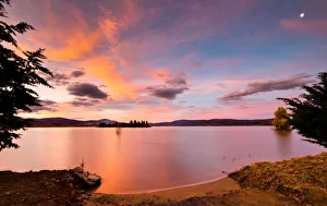 Pink and Orange Clouds on a Blue Sky at Sunset over Lake Jindabyne, Australia Pink and Orange Clouds on a Blue Sky at Sunset over Lake Jindabyne, Australia
