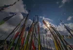 Images Dated 6th March 2015: Prayer flags fluttering in the breeze on a mountain pass in central Bhutan