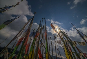 Prayer flags fluttering in the breeze on a mountain pass in central Bhutan Prayer flags fluttering in the breeze on a mountain pass in central Bhutan