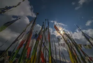 Prayer flags fluttering in the breeze on a mountain pass in central Bhutan