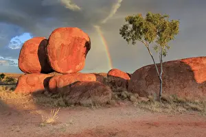 Rainbow over Karlu Karlu / Devils Marbles Conservation Reserve. Northern Territory. Australia