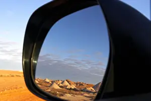 Reflection in car mirror in opal mining area of Coober Pedy in the South Australian Outback