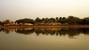 Images Dated 26th December 2016: River Gambia at sunset with Tendaba settlement reflections on calm water during sunset
