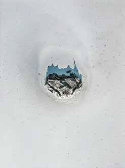 Abstract Aerial Art Prints: Rock formation in a dry salt lake shot from a drone point of view on a sunny day