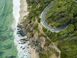 <b class=qtipBold><figcaption>rocky outcrop into ocean with road</figcaption></b><br>looking down on the Australian coastline with rocky outcrop and windy road<br><em>© (C) Vicki Smith</em> rocky outcrop into ocean with road