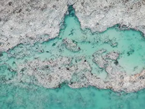 Abstract Aerial Art Prints: Sand eroding in an estuary shot from directly above