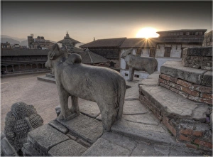 Setting sun over the village square at Bhaktapur, Western Himalayas, Nepal Setting sun over the village square at Bhaktapur, Western Himalayas, Nepal