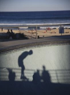Images Dated 21st November 2014: Shadow of skater with beach in background