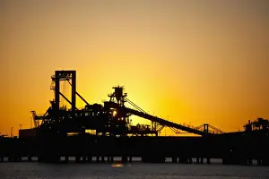 Building Exterior Prints: Silhouette of a bucket wheel reclaimer at an iron ore mine