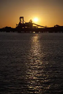 Silhouette of a bucket wheel reclaimer at an iron ore mine