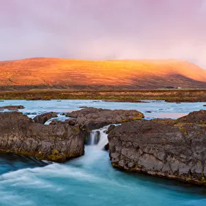 Small Icelandic waterfall at sunrise Small Icelandic waterfall at sunrise