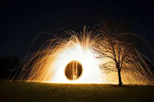 Kathryn Diehm Prints: Steel wool spinning near tree at night