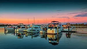 Ian Rolfe's Southern Lightscapes Prints: A summer dawn light castes a glow over the boats and harbour area at Lakes Entrance