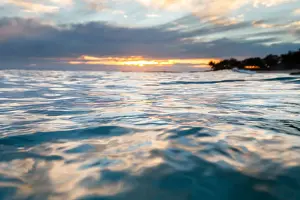 Prints of Queensland (QLD) Queensland (QLD) Prints: Sunrise in the water seeing the first light hit the ripples on the ocean surface