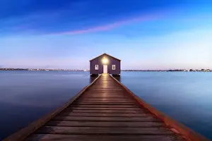 Travel Prints: Sunset over blue boathouse in the Swan River in Perth, Western Australia, Australia