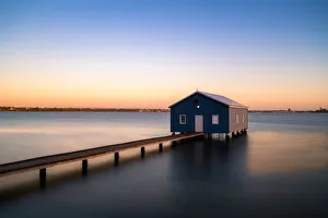 Sunset over blue boathouse in the Swan River in Perth, Western Australia, Australia Sunset over blue boathouse in the Swan River in Perth, Western Australia, Australia