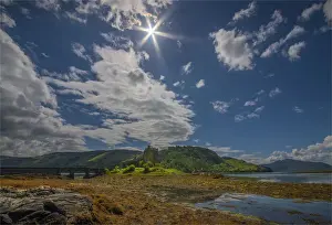 Castle Prints: Sunstar over Eileen Donan Castle, highland of Scotland