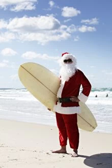 Images Dated 4th October 2015: Surfing Santa