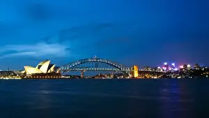 Sydney Harbour Bridge & Opera illuminated at dusk