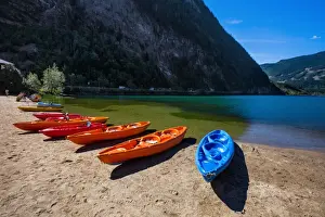 Lakeshore Prints: View of Three Valley Lake in Three Valley Gap with a Row of Canoes on the Trans-Canada Highway