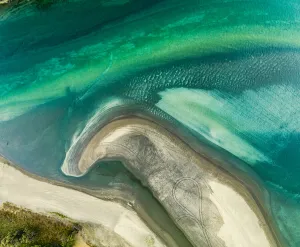 Top View of Waiwera beach with see through water, Auckland, New Zealand Top View of Waiwera beach with see through water, Auckland, New Zealand