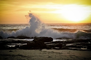 <b class=qtipBold><figcaption>Wave and sunset</figcaption></b><br>A large wave crashes on the shoreline near Margaret River in Western Australia during the sunset. Wave and sunset