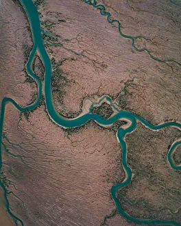 Winding river channel at low tide as seen from drones point of view, Lincolnshire Winding river channel at low tide as seen from drones point of view, Lincolnshire
