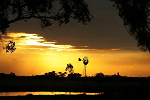 Windmill silhouette at sunset