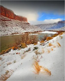 Colorado River Prints: A winter mantle of snow lies along the banks of the Colorado river near Moab in Utah