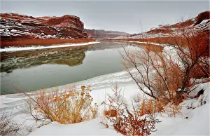 Colorado River Prints: A winter mantle of snow lies along the banks of the Colorado river near Moab in Utah