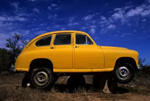 Yellow car on Barrels