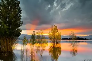 Yellow, Orange, Pink, and Gray Clouds at Sunset over Lake Jindabyne, Australia