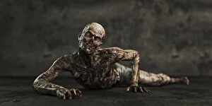 Images Dated 21st June 2018: Zombie man crawling on floor